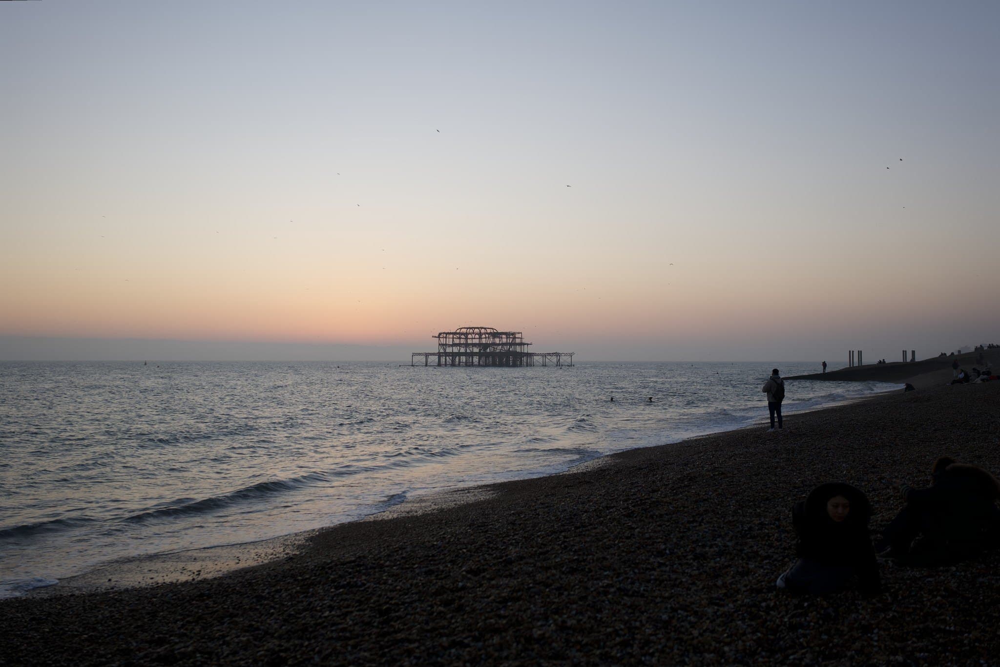 The West Pier at dusk from Brighton beach, before editing